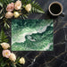 Creative home office with an emerald sea wave wallpaper backdrop and a sleek wooden desk