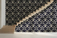 A formal exibition hall featuring a classic damask wallpaper accent wall