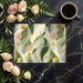 Sunlit dining room with an abstract leaf mural providing a soft, creative backdrop.