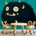 Playful monster themed nursery wall with minimalist decor