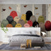 A cozy bedroom featuring the bird flock wallpaper as a playful, artistic accent wall.