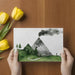 Modern home office with a watercolor landscape wallpaper that inspires focus and creativity