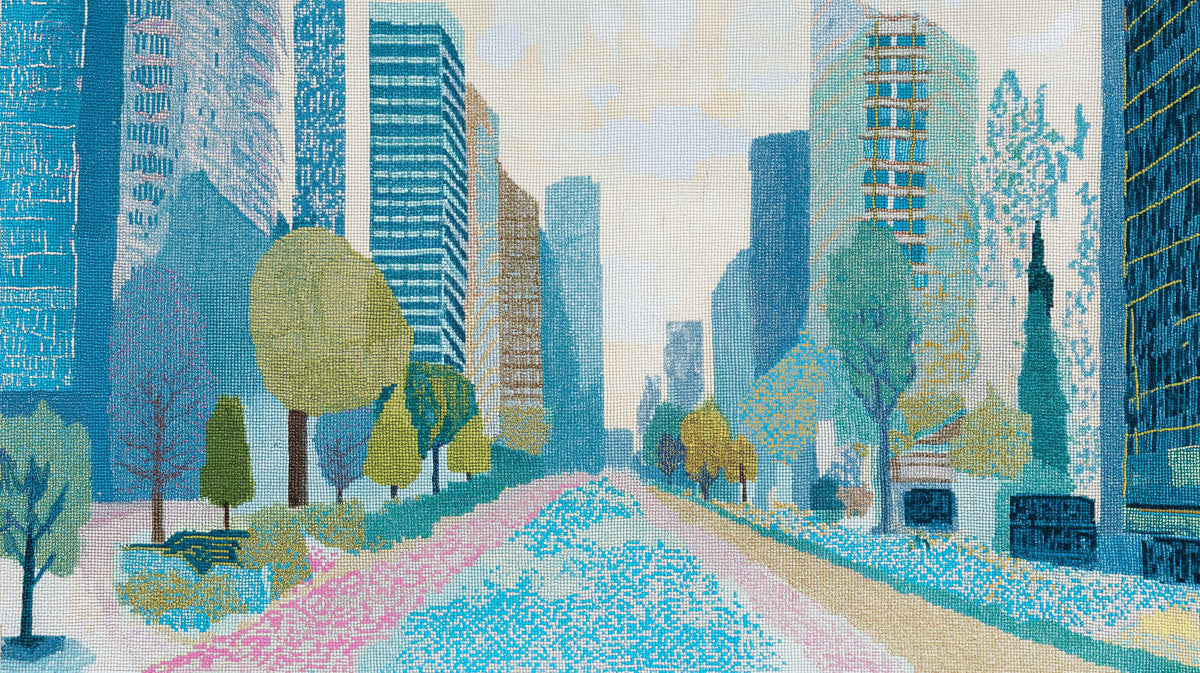 Textured cross-stitch style mural wallpaper featuring a blue cityscape with green trees and a pink path