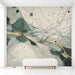 Elegant entryway wall featuring fluid green and gold abstract mural wallpaper with soft warm ambient lighting.