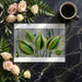 A stylish home office space with an artistic botanical wallpaper backdrop.