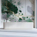 Modern reception wall featuring fluid green and gold pattern mural with brass accent lighting.