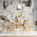 Bright dining room with fluid botanical sketch mural creating an elegant backdrop