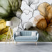 Modern living room featuring the ginkgo watercolor mural as a light and airy backdrop behind a neutral sofa.