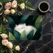 A relaxing bedroom wall mural depicting a fluffy cat hidden in tropical foliage.