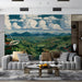 A sophisticated living room wall decorated with a rolling green hills mural and wooden furniture.