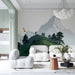 A commercial space with a panoramic mountain range mural as a headboard feature wall.