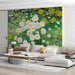 Living room wall covered in a botanical wildflower mural with white flowers and green leaves