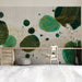 Study wall featuring an abstract emerald and gold mural behind a neutral velvet sofa.