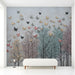 Butterfly forest mural installed in a dreamy entryway with white wooden furniture