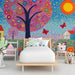A creative bedroom wall decorated with a vibrant meadow wallpaper mural and minimalist wooden desk.