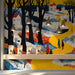 A cozy shop featuring a whimsical winter path mural as a vibrant background for a wooden desk.