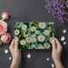 Sunny home office space with a vibrant botanical wall mural creating an energetic backdrop.