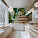 Cozy bread shop interior showcasing a lush daisy and mimosa wallpaper design behind a neutral bed frame.