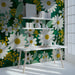 Cheerful study featuring a bold daisy mural on the primary accent wall with light wood furniture.