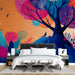Modern bedroom space decorated with a bold, bright, and whimsical nature-themed mural