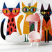 A bright, colorful nursery room featuring the cat mural as a fun, creative accent wall.