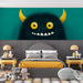 A vibrant study area for children decorated with a character-themed wallpaper.