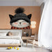 A Bedroom corner decorated with the charming cat mural to create a relaxed and cheerful workspace.