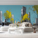 Minimalist living area with artistic cityscape wall mural and light wood dining table