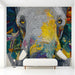 Living room interior featuring a large colorful mosaic elephant wall mural behind a modern sofa