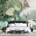 A creative bedroom wall decorated with a whimsical cat and foliage illustration for a calm work environment.