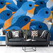 A colorful, playful entryway featuring bluebird patterned wallpaper on an accent wall