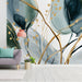 Elegant entryway decorated with watercolor leaf wallpaper in deep green and shimmering gold tones