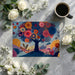Whimsical forest garden wallpaper pattern featured on an accent wall behind a dark wood desk in a home office.