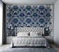 Traditional floral damask mural in a grand bedroom with dark wood furniture