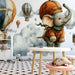 Nursery room design with a dreamy floating elephant wallpaper for a soft imaginative feel