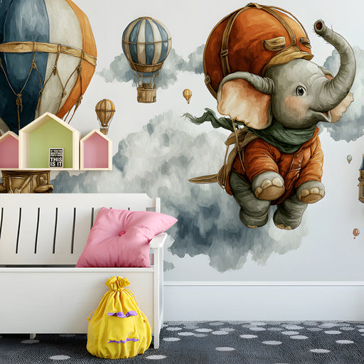Kids bedroom wall featuring a floating elephant mural with soft blue and orange accents