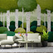 A cozy reading nook featuring the dot-art forest mural with a comfortable velvet accent chair.