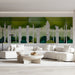 The birch tree mural installed in a serene modern hotel hallway above a neutral platform bed.