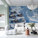 Playful snowy mountain wallpaper in a living room with wooden furniture