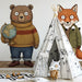 Storybook style bear and fox wall decor in a nursery with wooden furniture