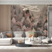 A cozy living room featuring the blush forest manor mural behind a tufted headboard.