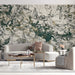 Minimalist living room with expressive dark ink and gold line art mural