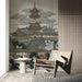 The pagoda mountain mural installed behind a wood-tone bed frame in an entryway.