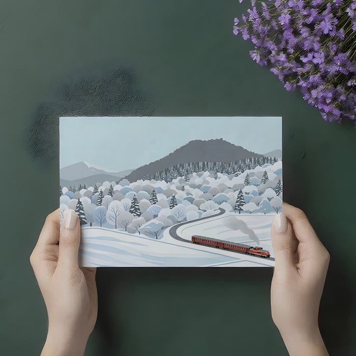 A bright, organized home office with a winter landscape train mural on the accent wall.