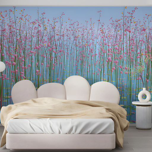 A cheerful bedroom featuring whimsical pink meadow wallpaper and soft pastel room accessories.