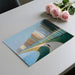 A home office with a painterly river landscape wallpaper, creating a calm and focused work environment.
