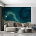 A sunlit reception room showing a landscape wallpaper with dramatic blue swirling skies.