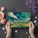 Dining room wall decorated with a bold impressionist landscape mural in vibrant blue and yellow.