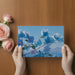 A modern dining room with the bougainvillea wall mural acting as a crisp, natural backdrop.