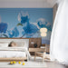 A quiet bedroom sanctuary showcasing the light blue botanical pattern above a minimalist headboard.
